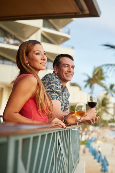 Couple enjoying the view at Voyager 47 Club Lounge at OUTRIGGER Waikiki Beach Resort
