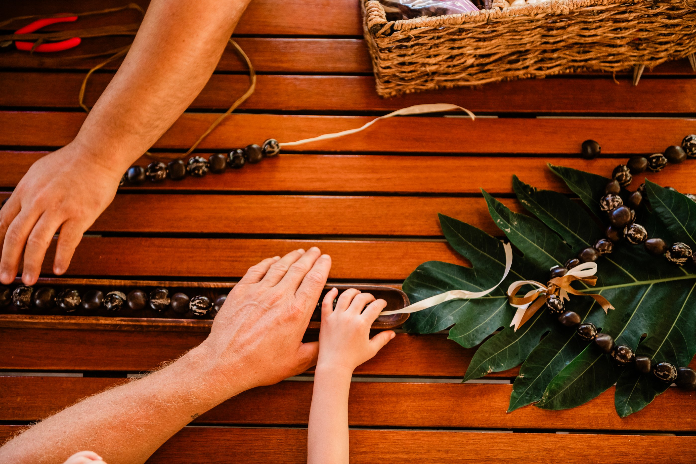 Restringing of kukui nut lei