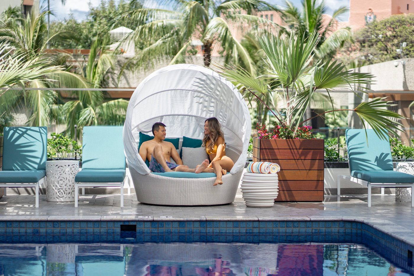 Guests enjoying the pool at Outrigger Waikiki Beachcomber Hotel.